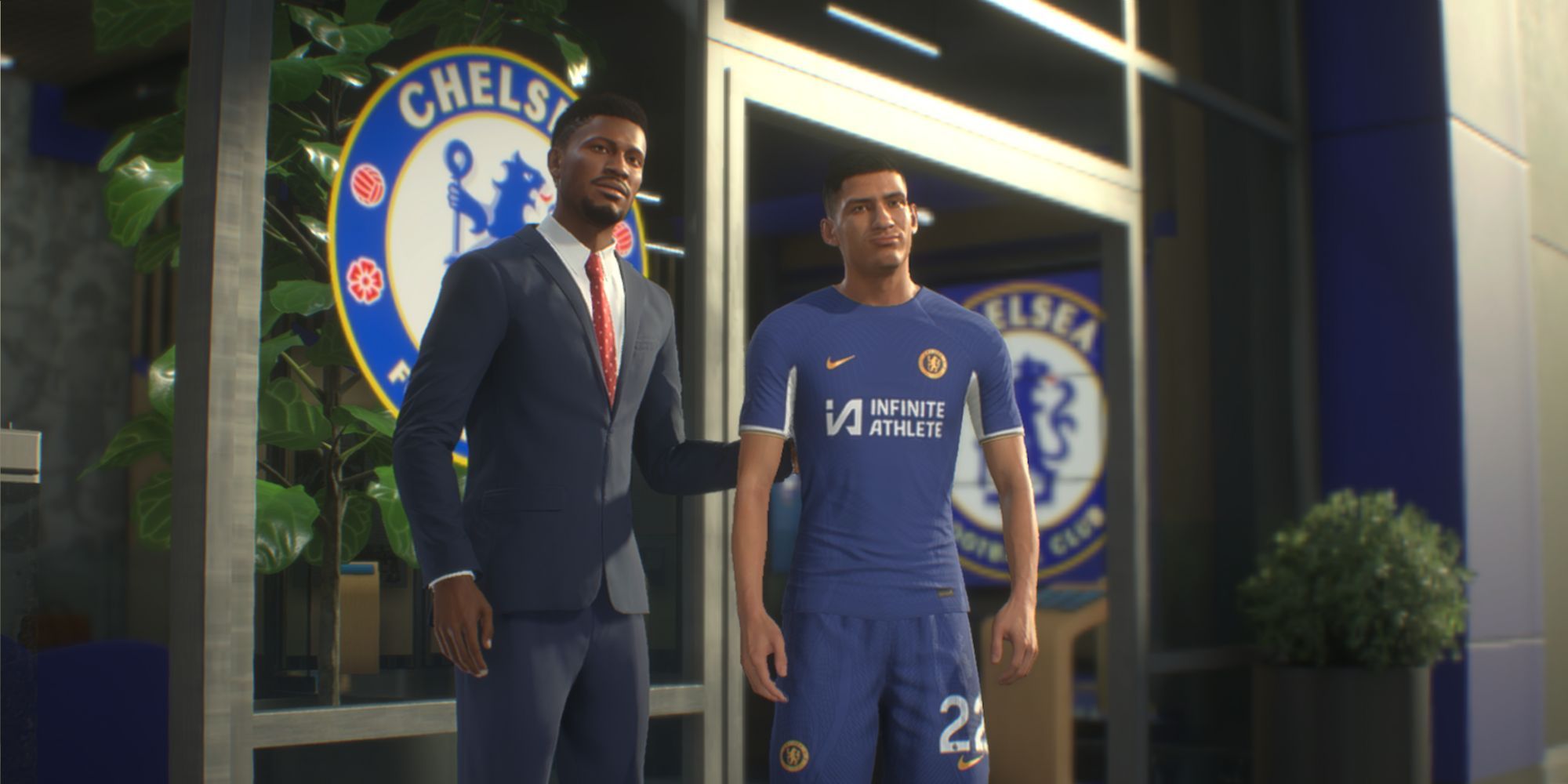 A custom Chelsea manager poses with a new signing in a cutscene from EA Sports FC 24 Manager Career.
