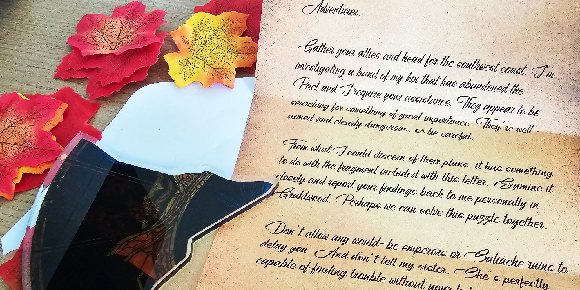 Elder Scrolls Online letter describing the discovery of a fragment which is laying next to the paper surrounded by autumn leaves