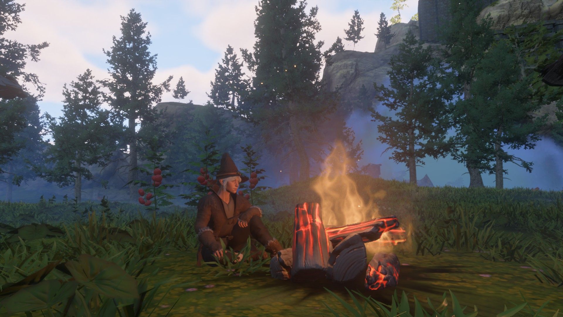 enshrouded player sitting at campfire