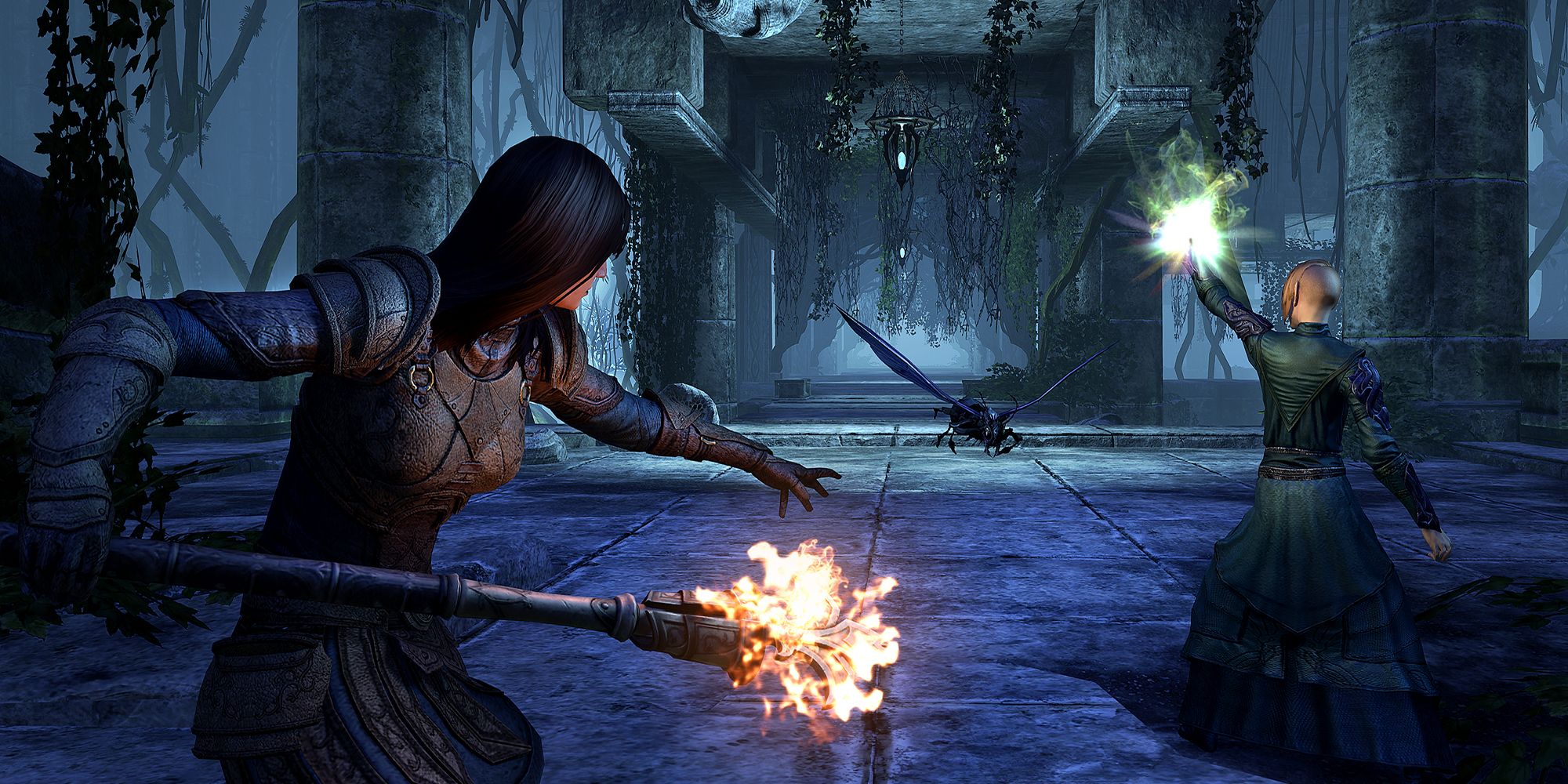 ESO Gold Road screenshot of two adventurers fighting bugs in an ayleid ruin with magic, one holding a staff the other casting with their hand