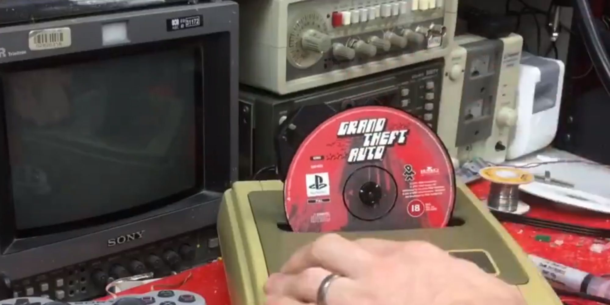 homemade Nintendo PlayStation console with exposed Grand Theft Auto disc