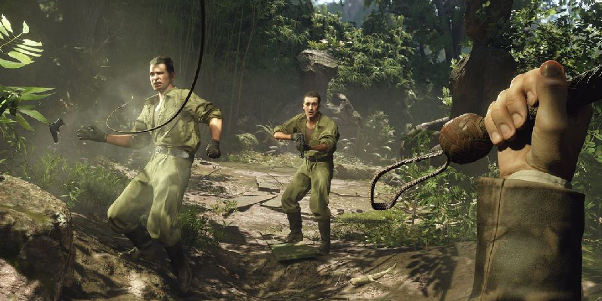 Indiana Jones gameplay showing him using his whip in first-person to disarm a guard, knocking their pistol out of their hand while another guard watches