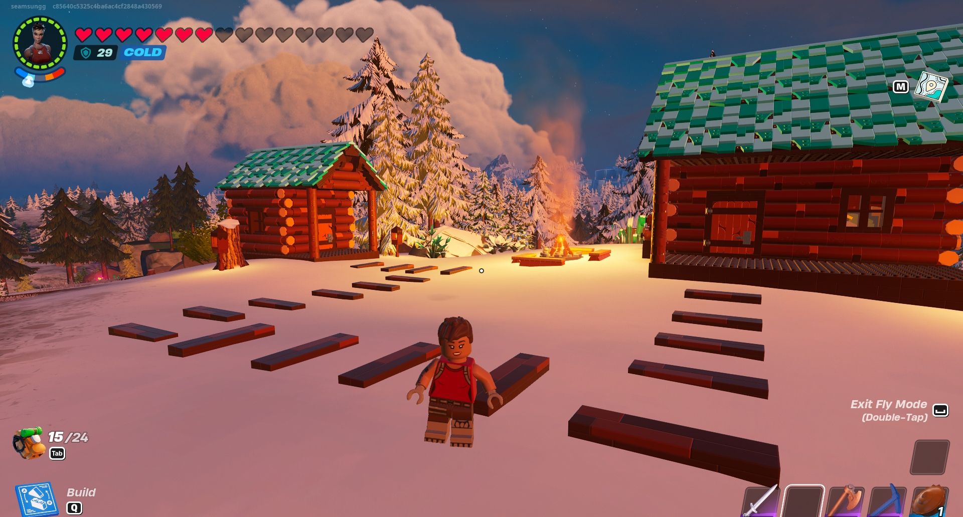 Lego Fortnite-Spieler in Frostlands neben zwei Blockhütten