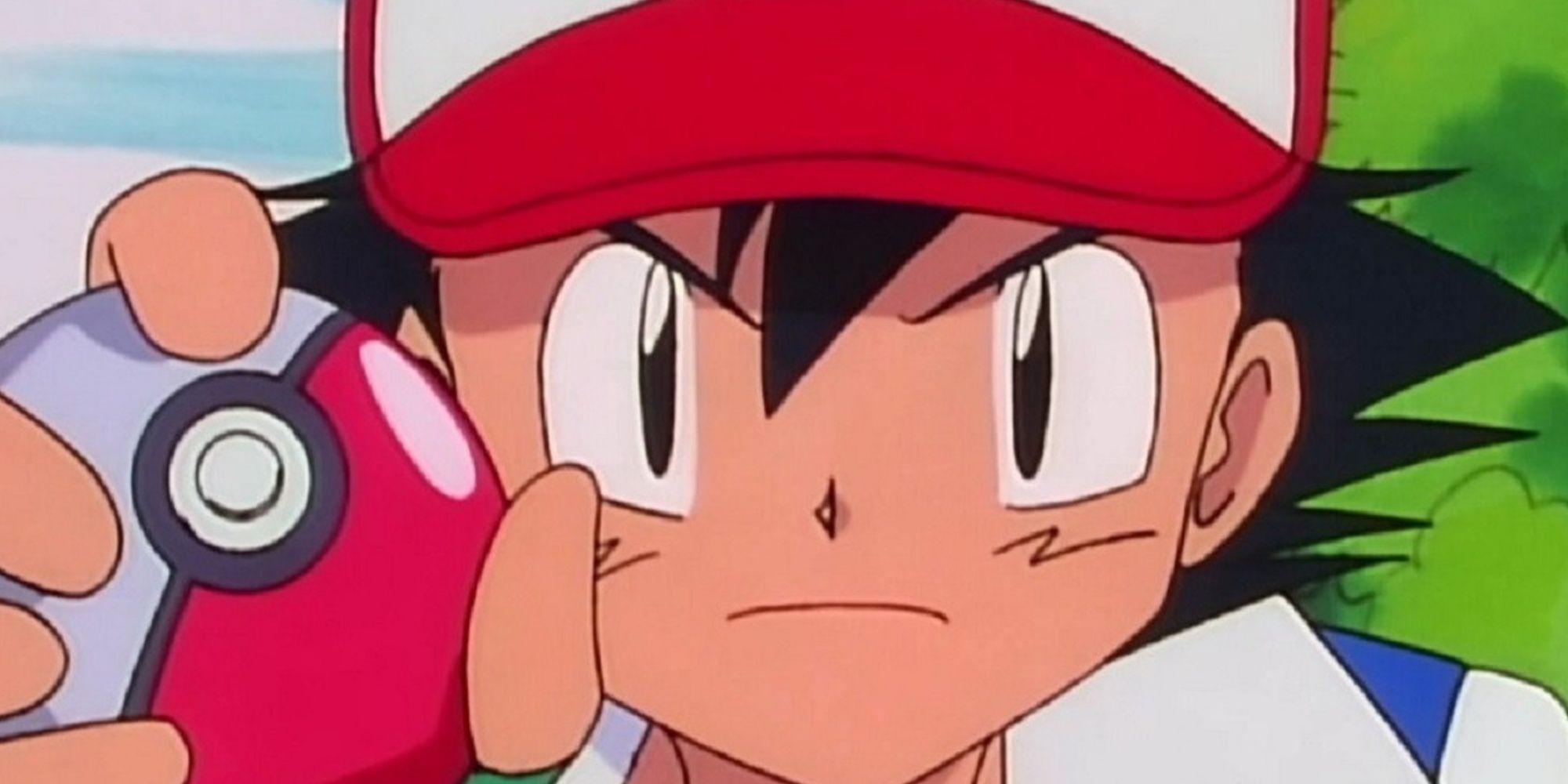 ash holding a pokeball in the pokemon anime