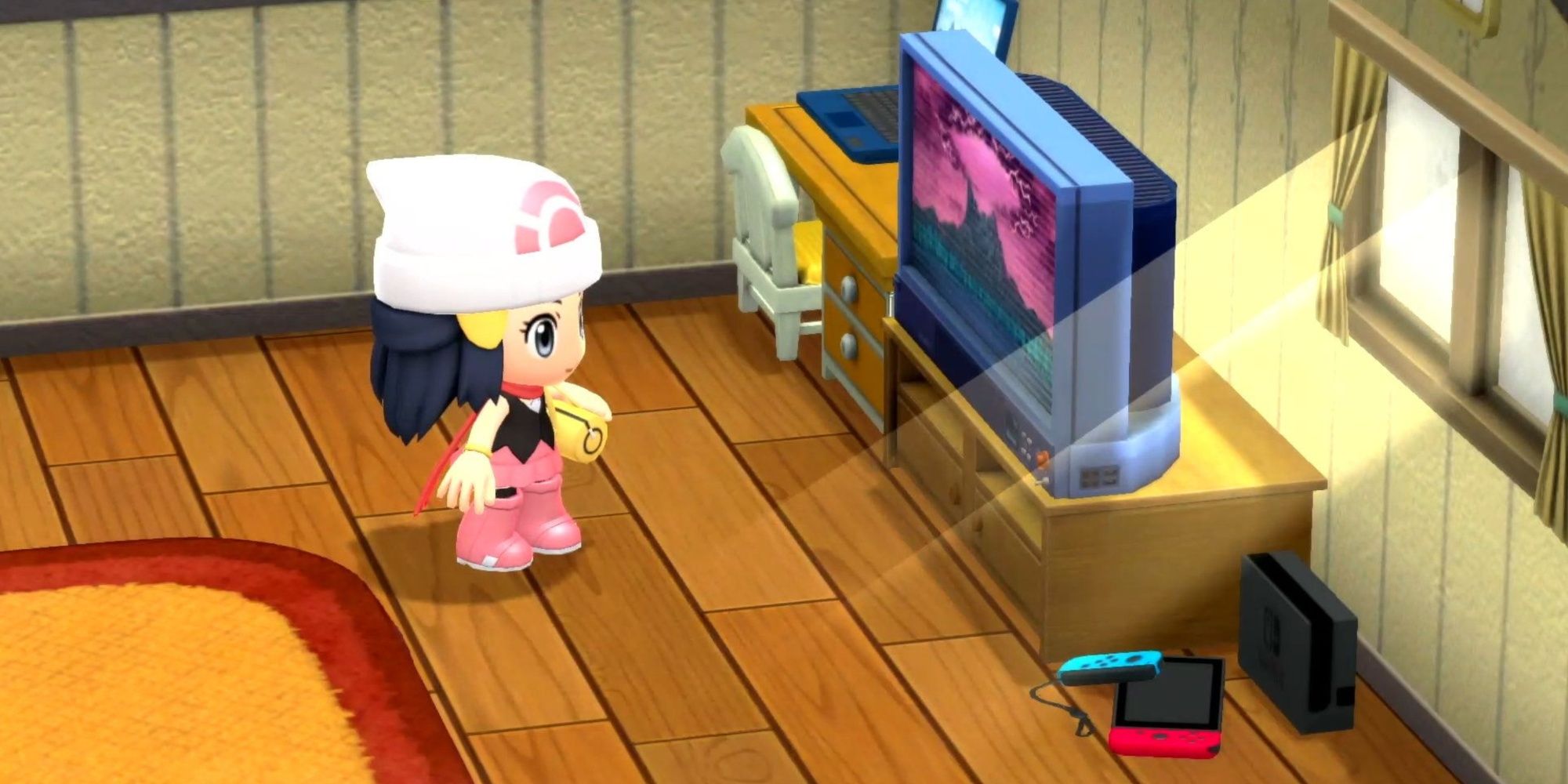 Mädchen in Pokemon mit glänzender Perle vor dem Fernseher