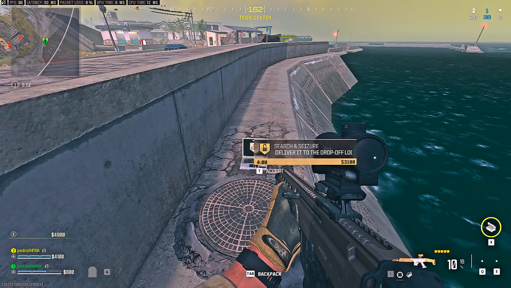 Player looking at a contract laptop on the Ashika shore in Call of Duty: Warzone
