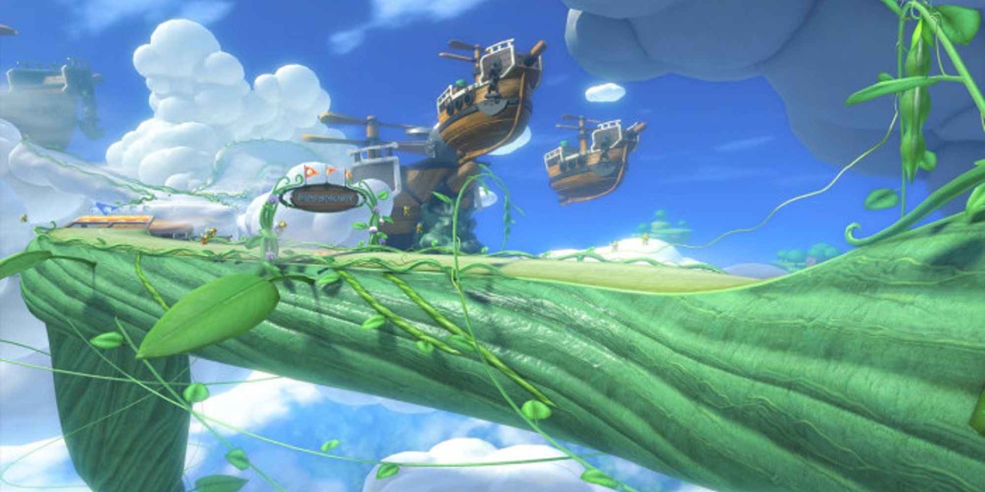 Mario Kart 8 Deluxe wide shot of the beanstalk and air ships from Cloudtop Cruise.