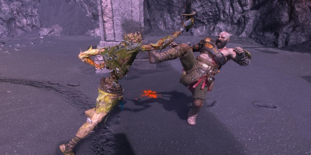 Kratos kicking an enemy as a representation of the Strength stat in God of War Ragnarok: Valhalla