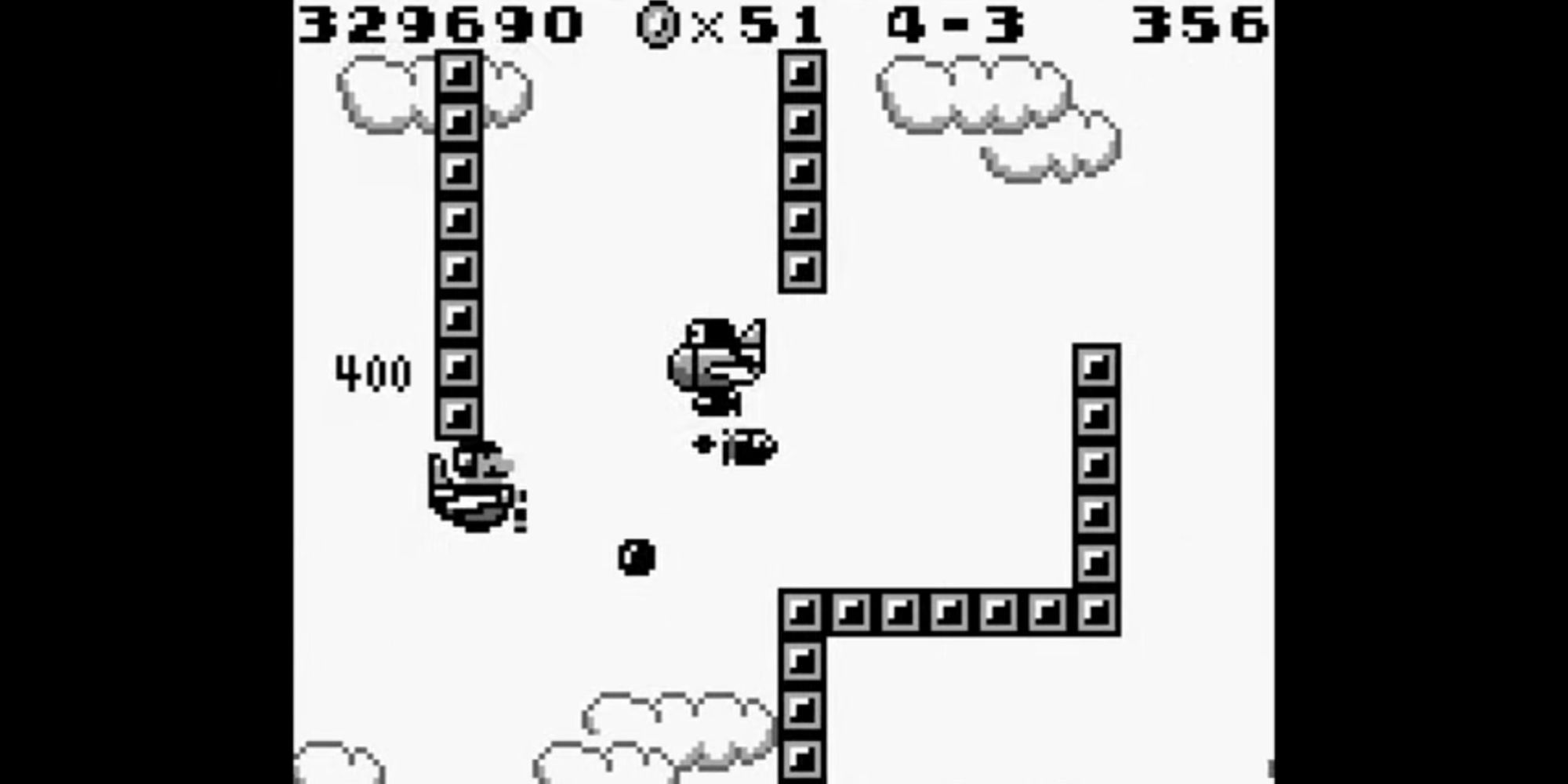  Mario flies a plane toward an enemy in the sky in Super Mario Land