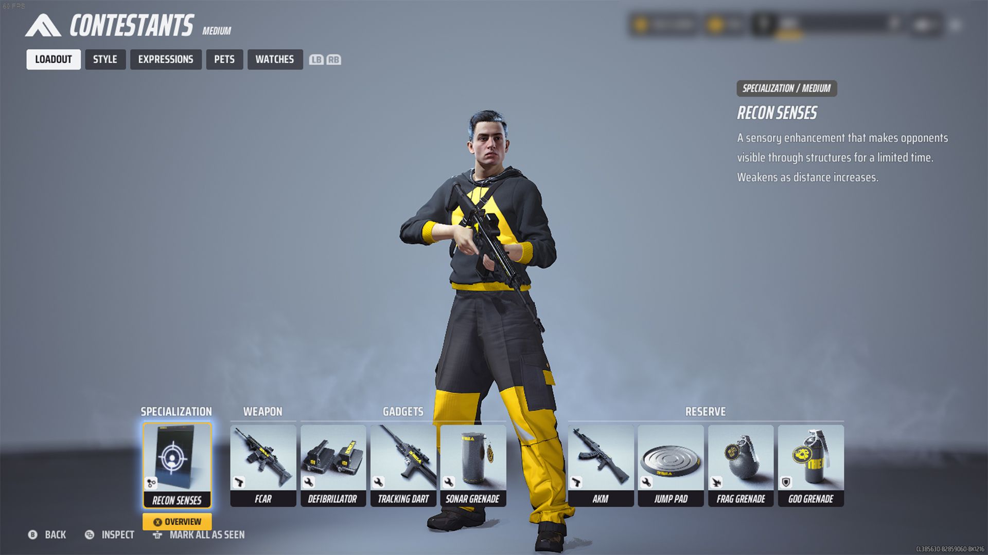 The Finals Male Medium Build Standing in Grey Background Holding Gun With The Loadout (Specialization: Healing Beam, Weapon: FCAR, Gadgets: Defibrillator, Tracking Dart, Sonar Grenade)
