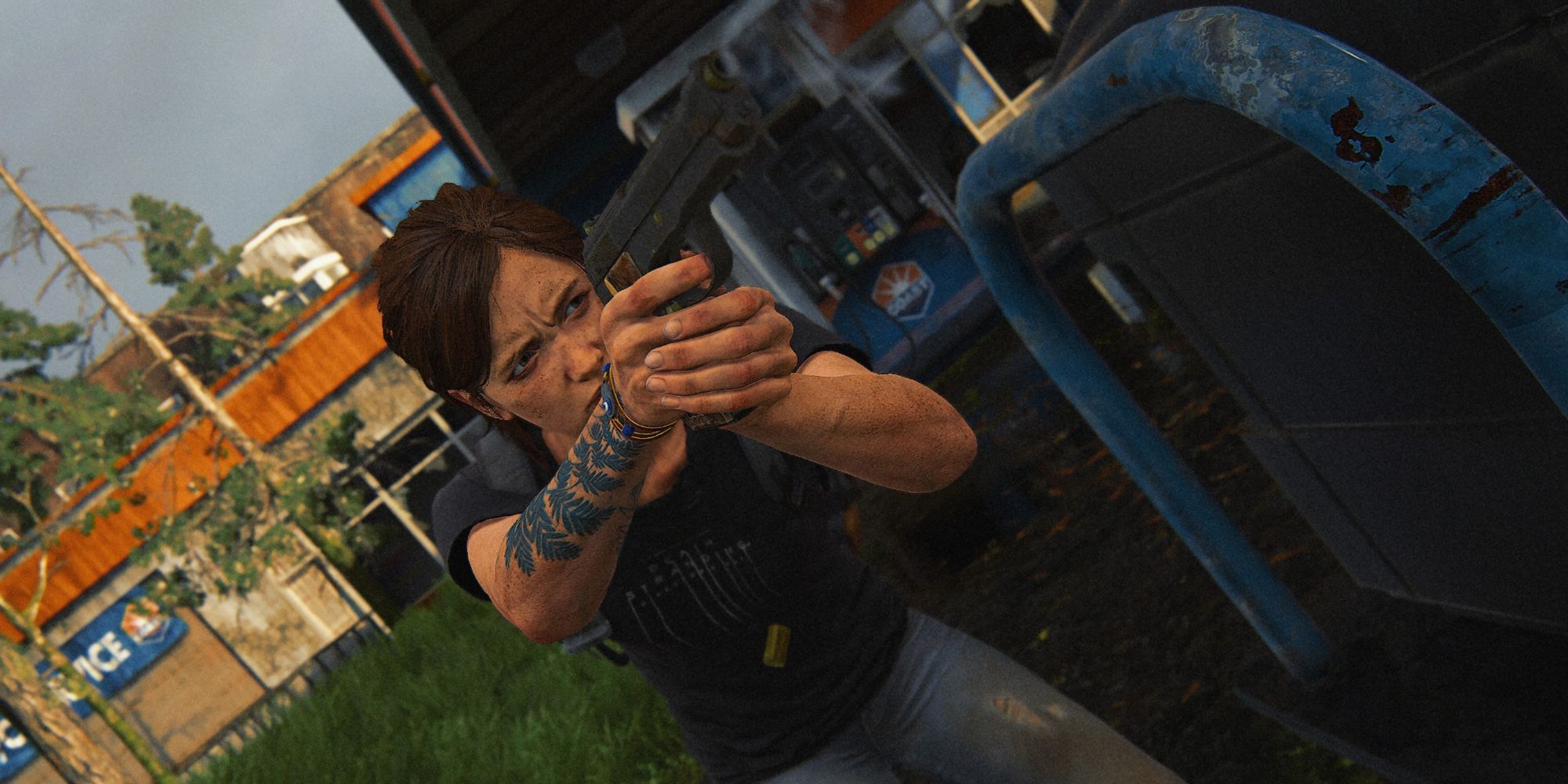 Ellie aiming a gun and showing off her tattoo in The Last of Us Part 2 Remastered.