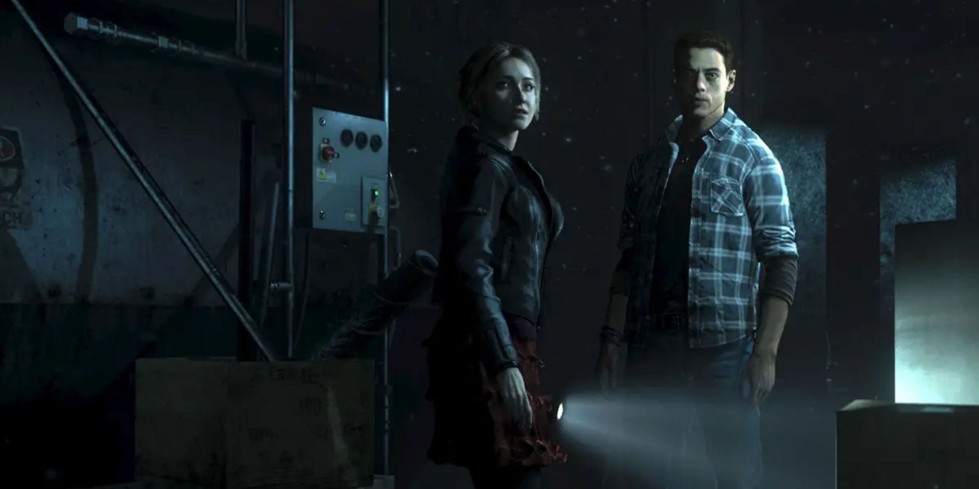 Two character from Until Dawn in a dark hallway