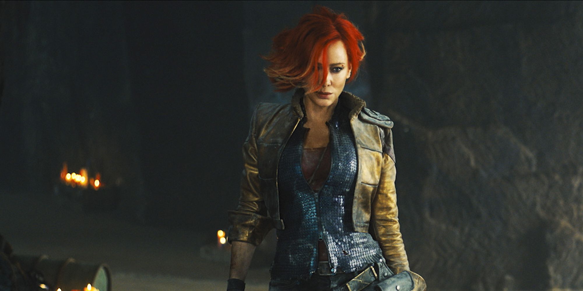 Cate Blanchette as Lilith in the Borderlands movie, walking towards the camera while her red hair swoops