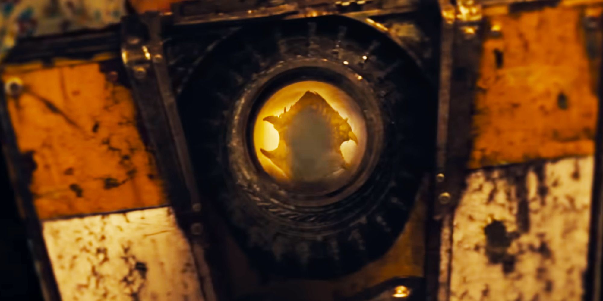 Claptrap from the Borderlands movie with a giant monster reflected in his eye