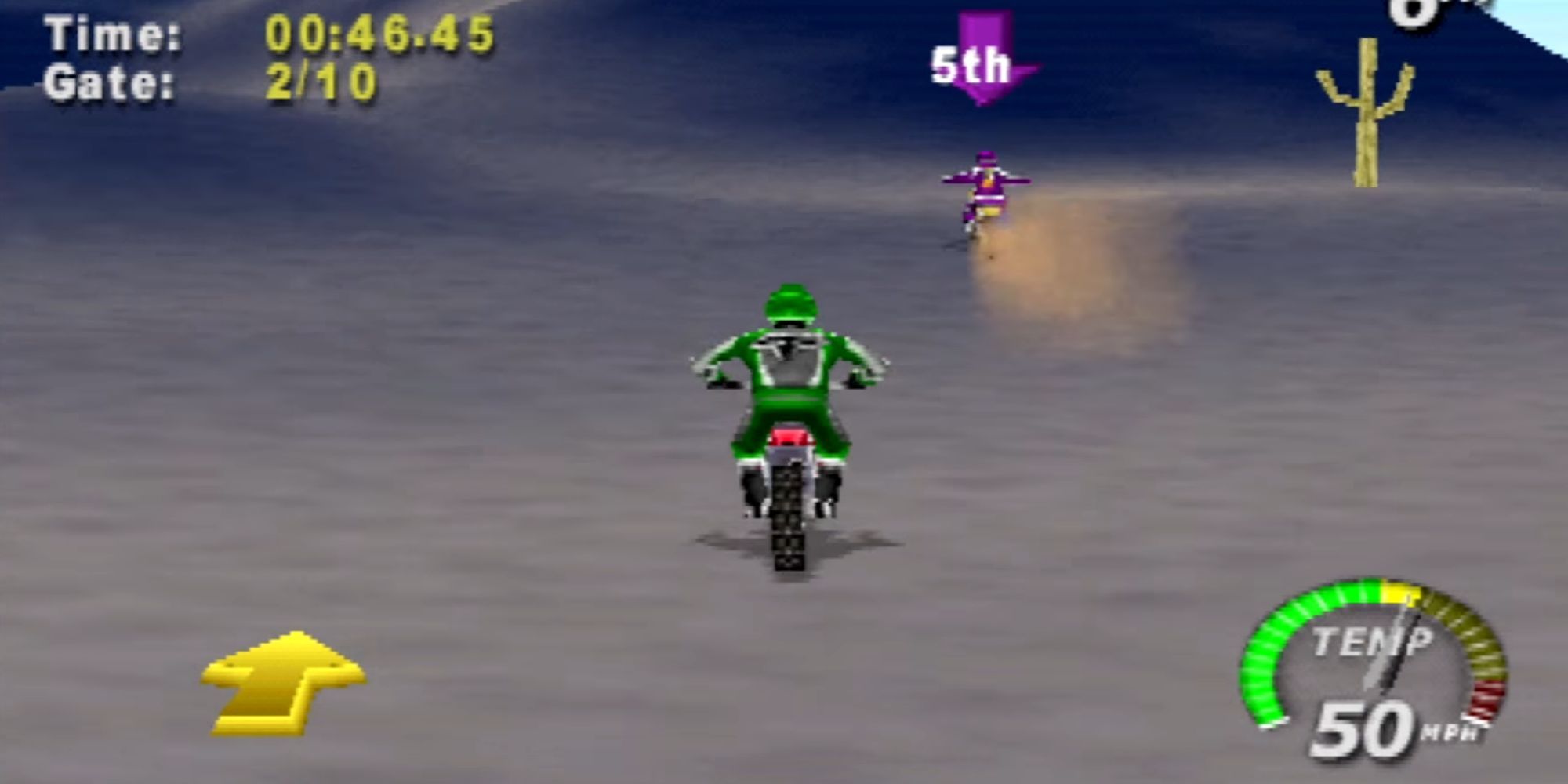 A motorcyclist wears a green jersey while driving through the desert