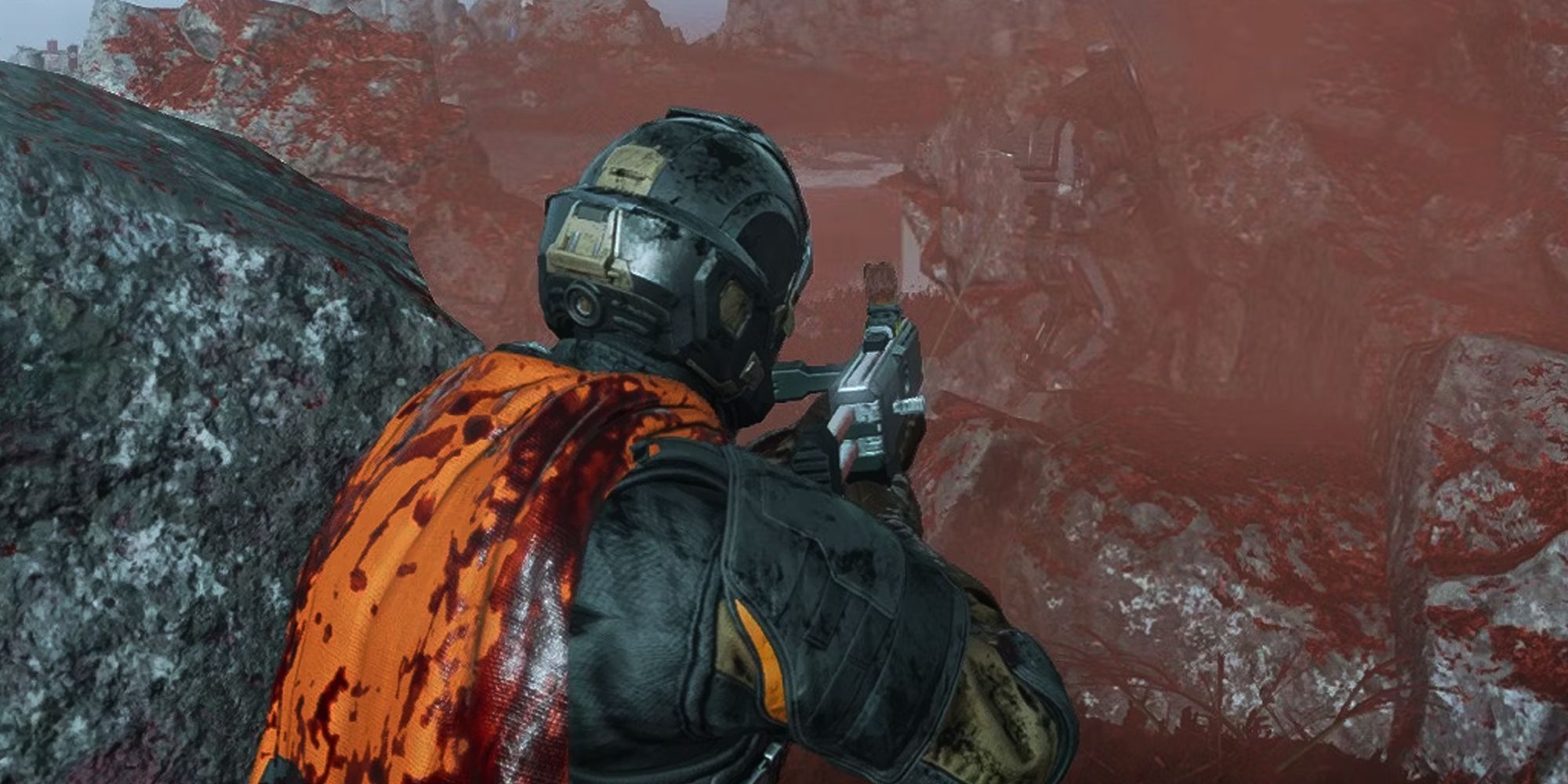 Helldivers 2 player pointing a gun at an automaton, wearing a bloodied orange cape