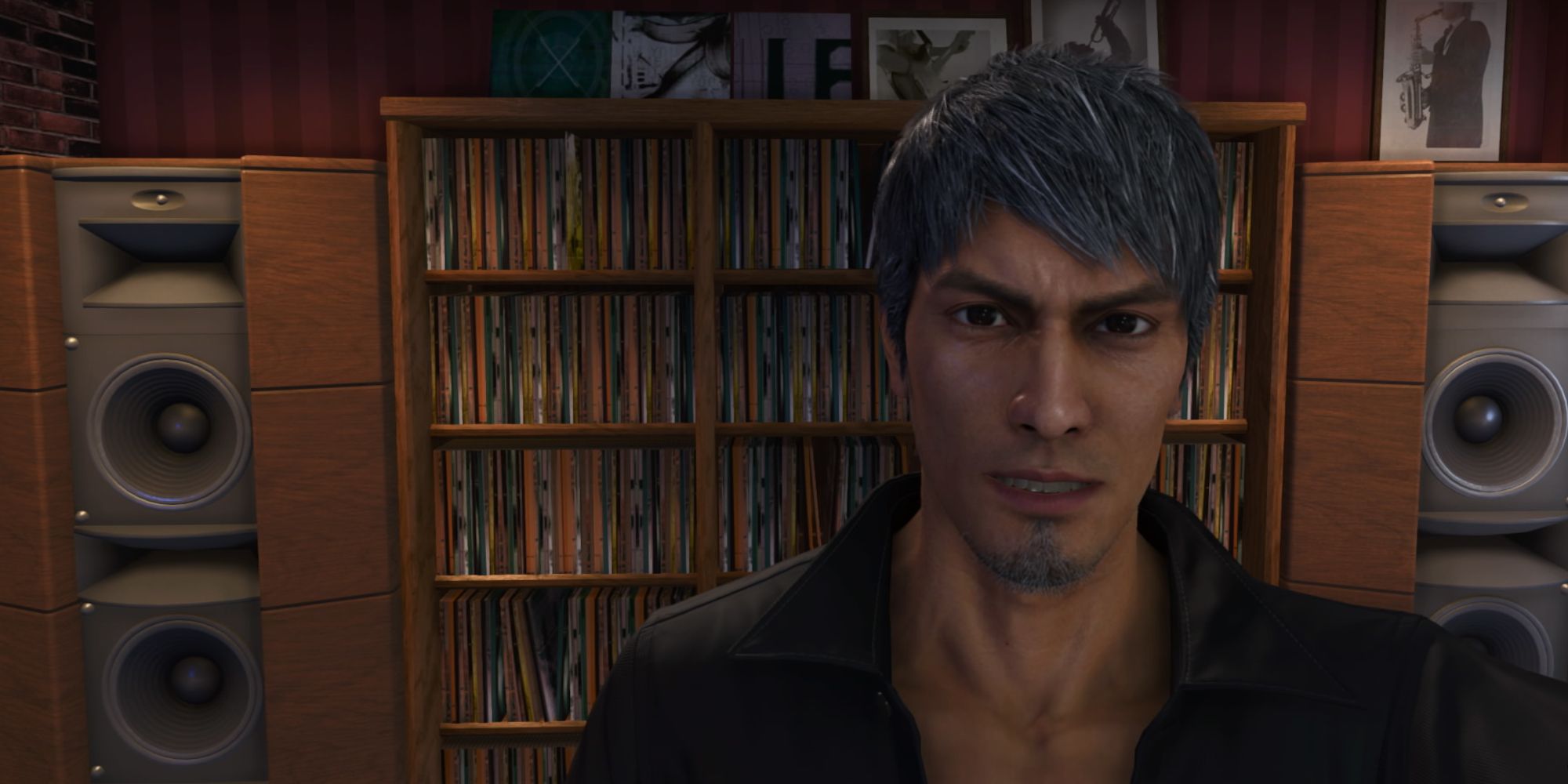 Like A Dragon Infinite Wealth, Kiryu taking a selfie in front of a shelf stacked with albums