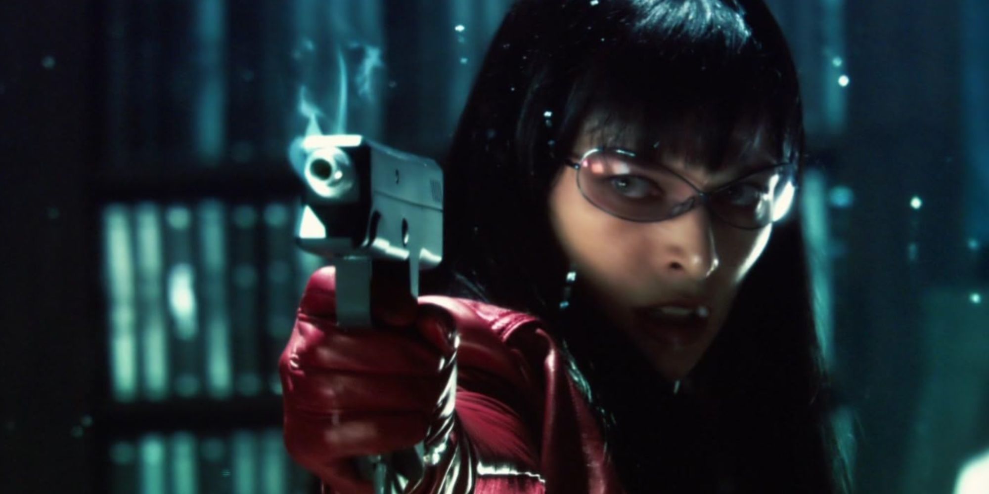 Close-up of Milla Jovovich in Ultraviolet as the main protagonist, with unique glasses and a smoking weapon pointed at enemies off-screen.
