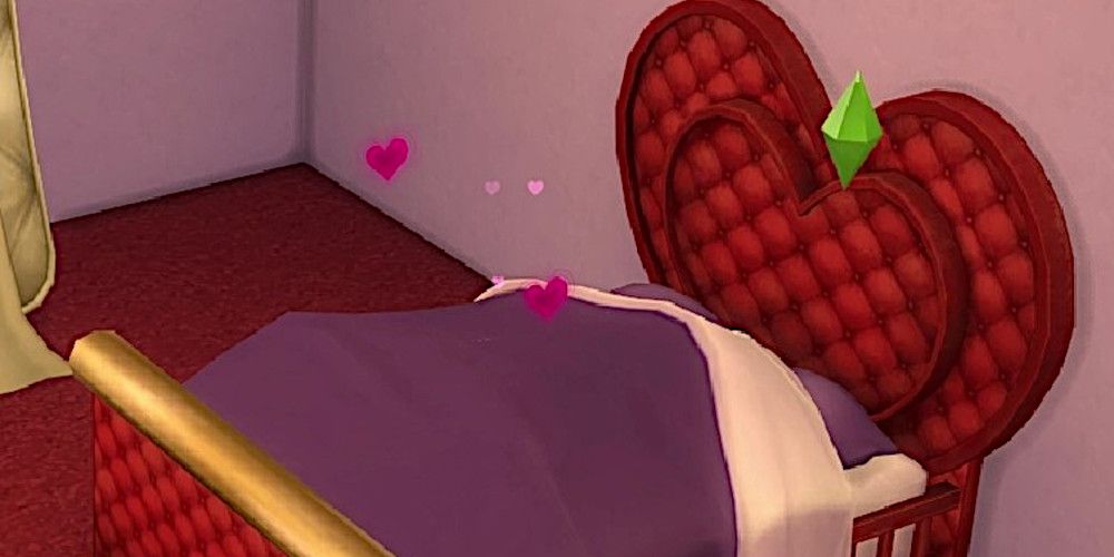 Screenshot of two Sims woohooing in a heart-shaped bed