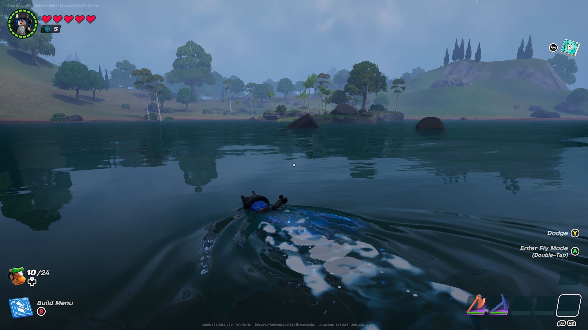 A player swimming in a lake with the Wavebreak Charm equipped in the Grasslands in Lego Fortnite.