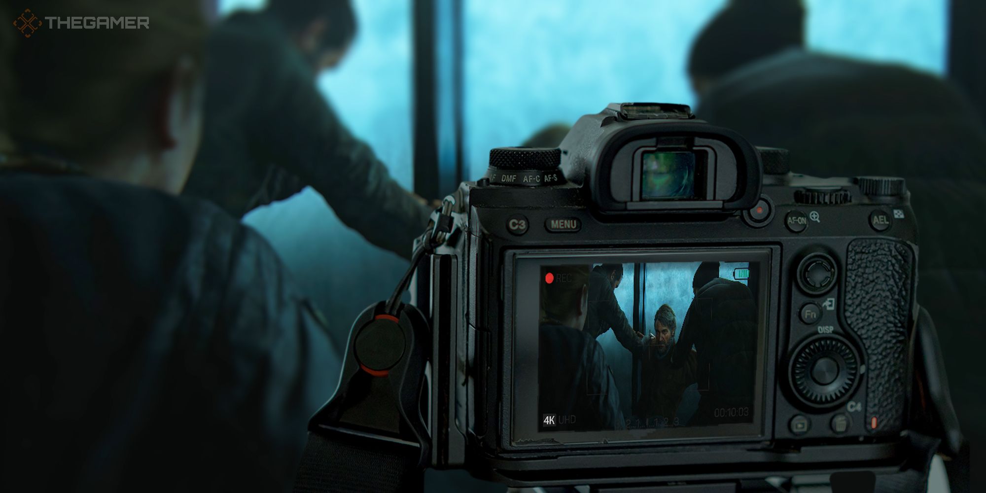A camera pointed at Joel's death scene from The Last of Us Part 2, with the scene seen through the camera's screen