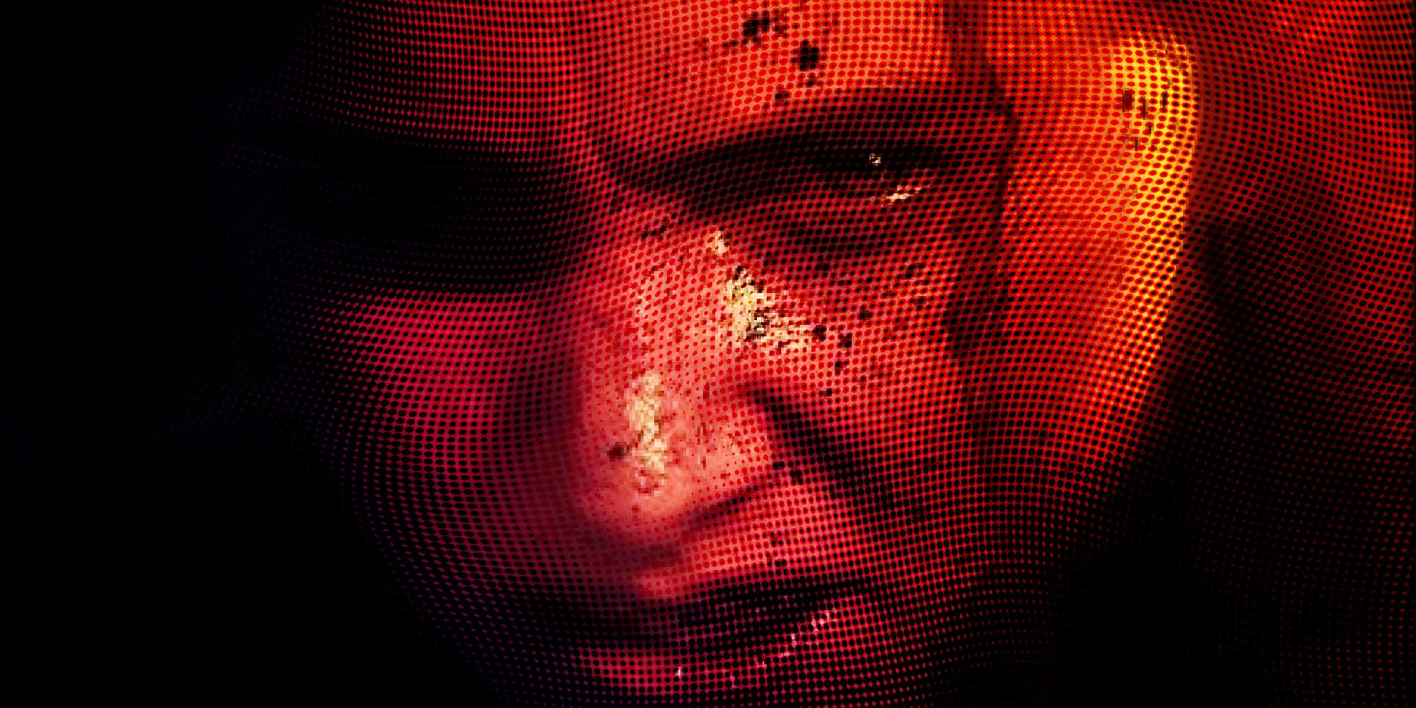 Ellie with blood spattered on her face in The Last of Us Part 2 with a red filter over
