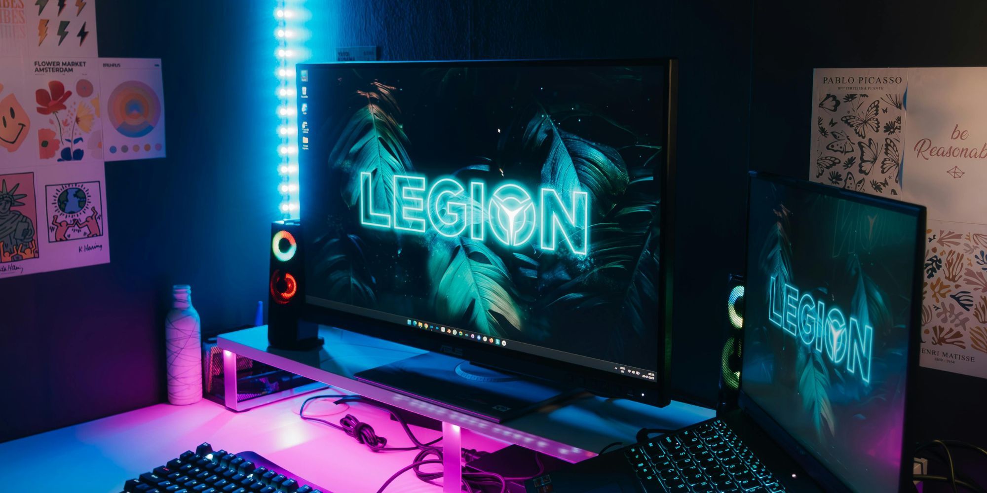 Gaming Monitor With Laptop And Speakers And RGB Speakers With Blue And Yellow Lighting Strips