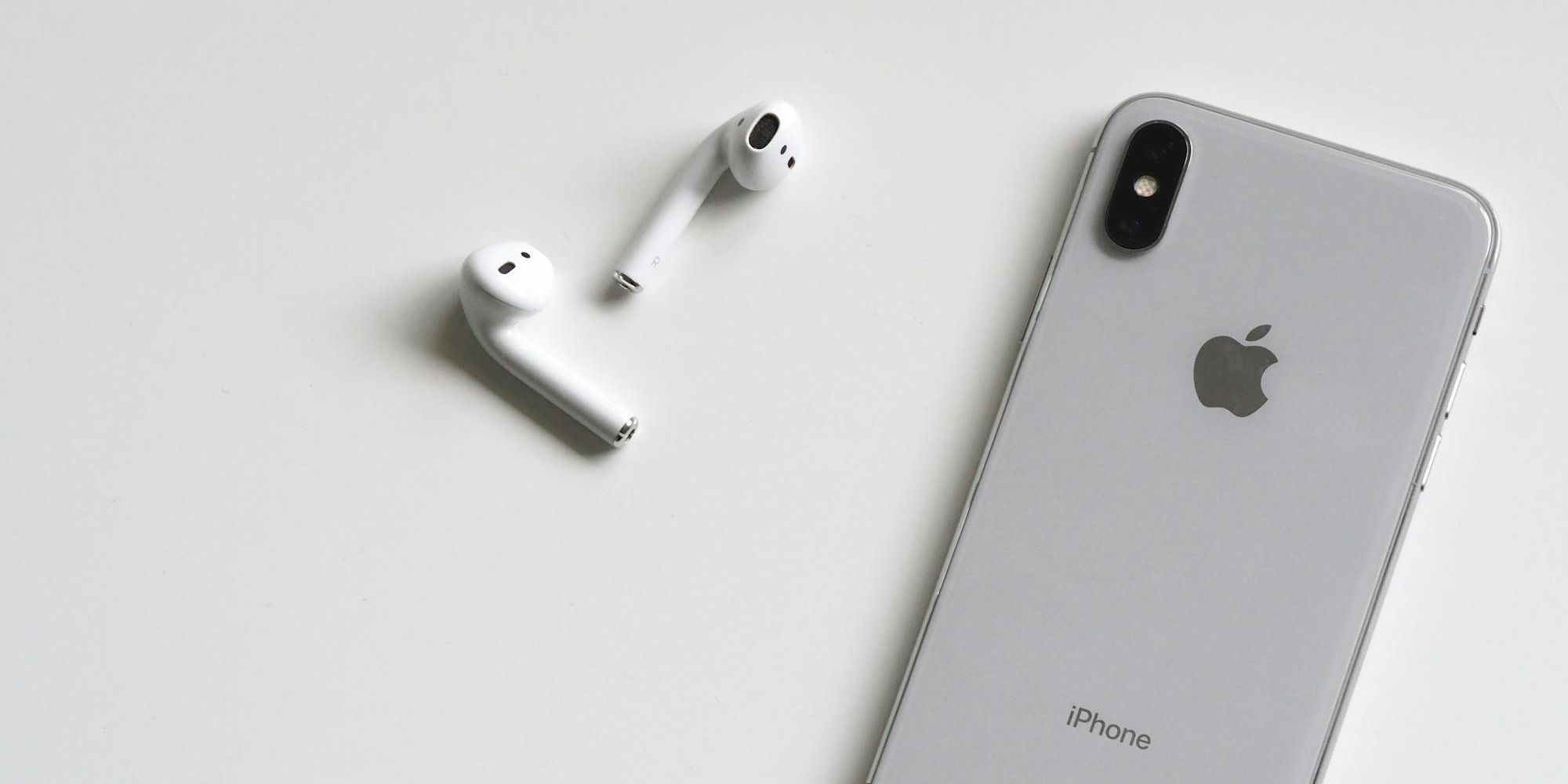 iPhone With AirPods On White Background