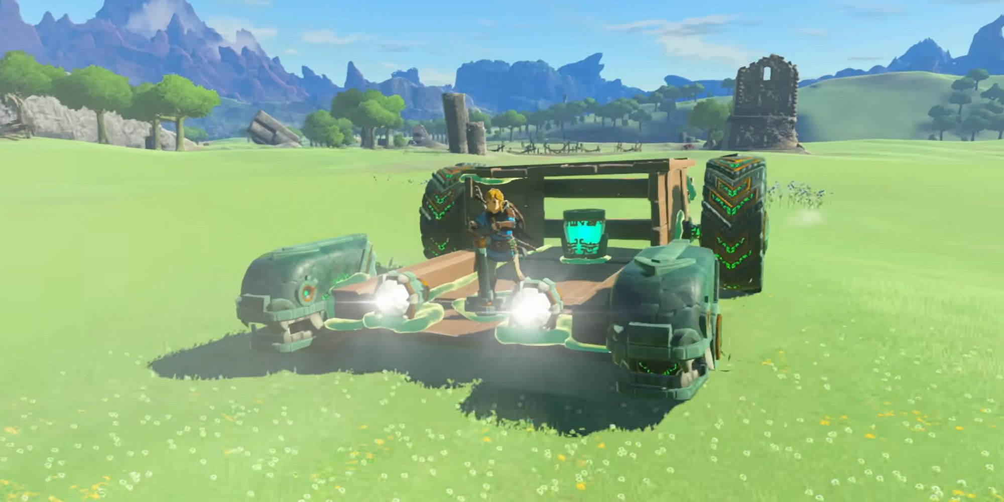 Link riding a large vehicle across some grassy plains in Tears of the Kingdom