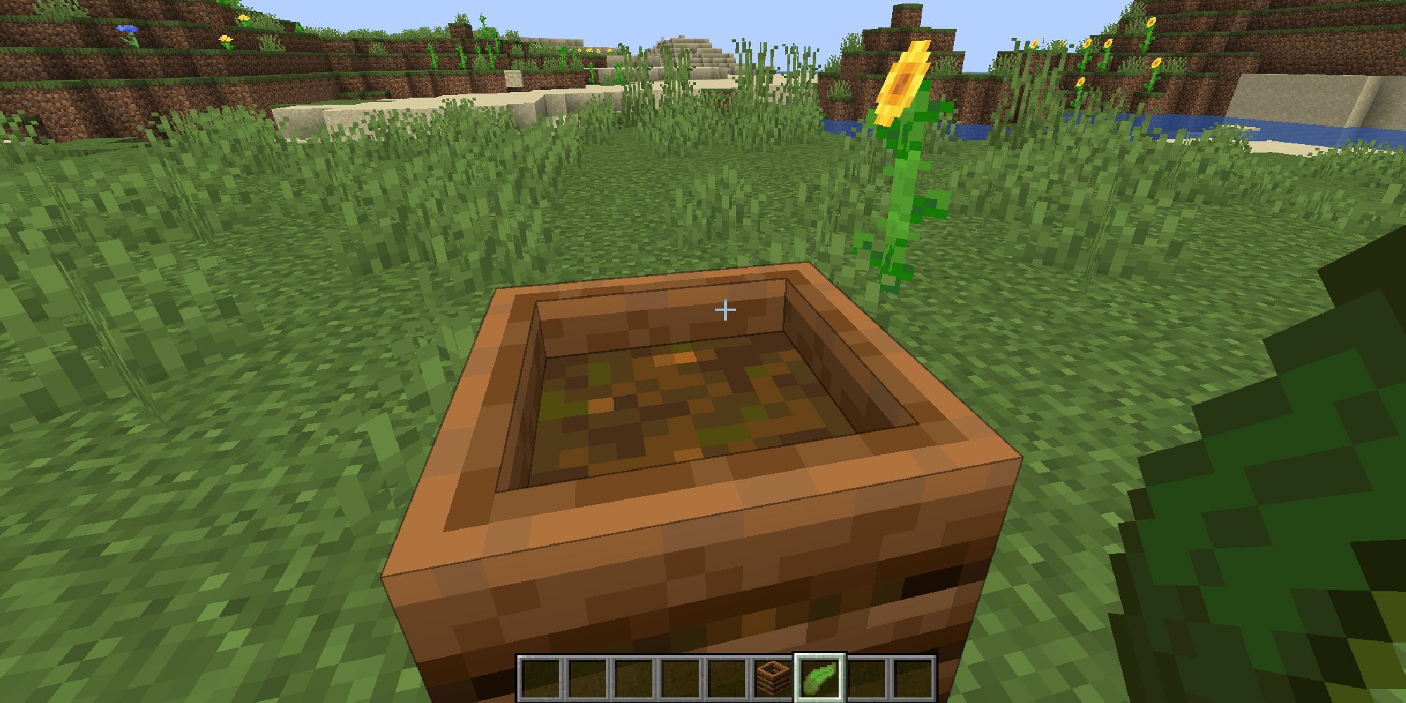 minecraft player putting kelp in composter