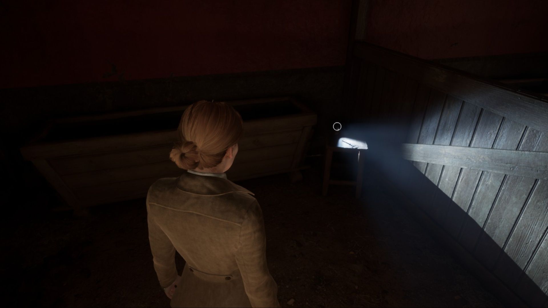 Emily discovering a key in the garage in Alone In The Dark.