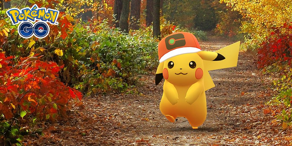 Image of Pikachu wearing a hat walking on a forest trail