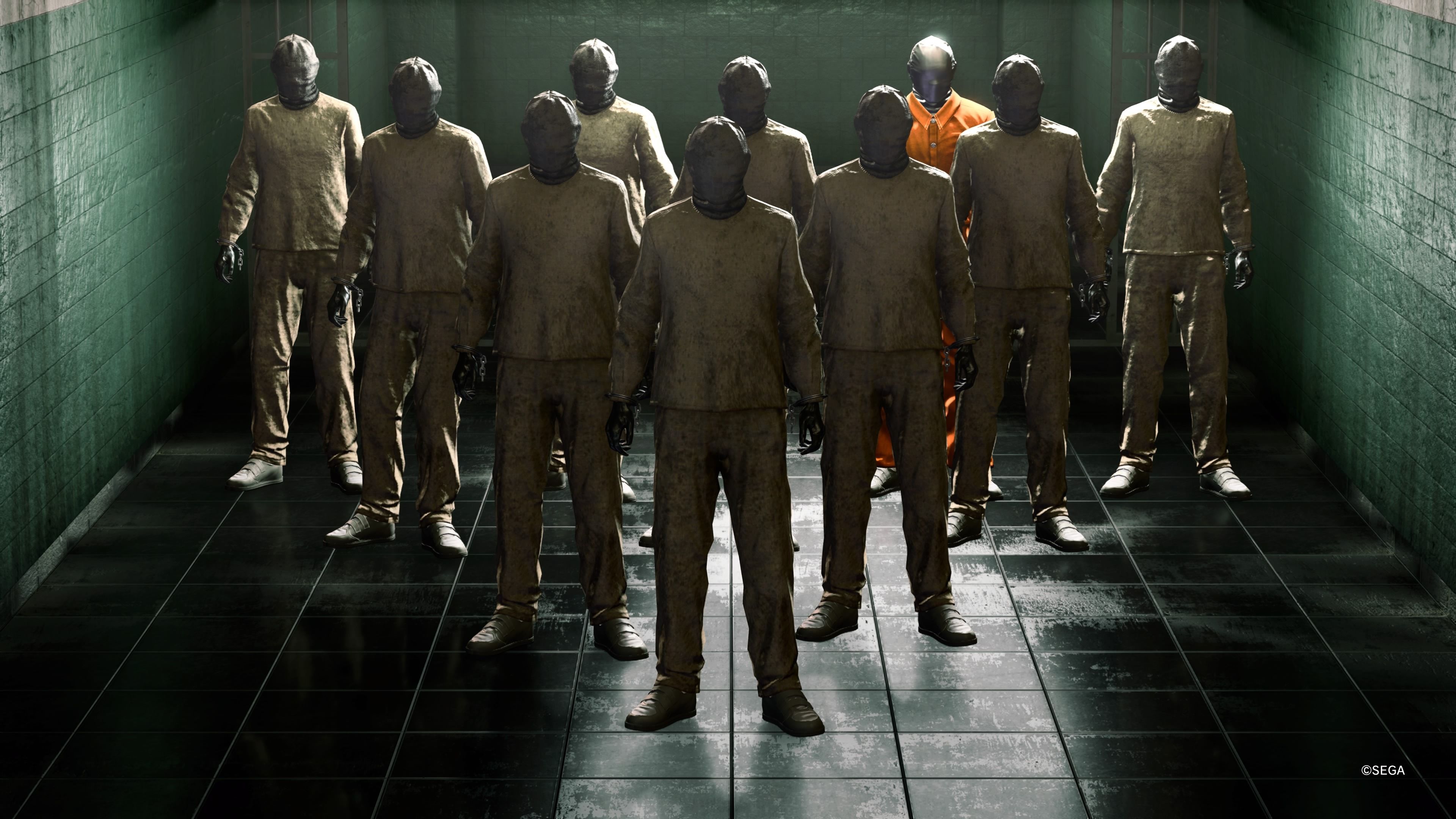 Rows of prisoners dressed in the same uniform with masks on. A man in the back has an orange jumpsuit 