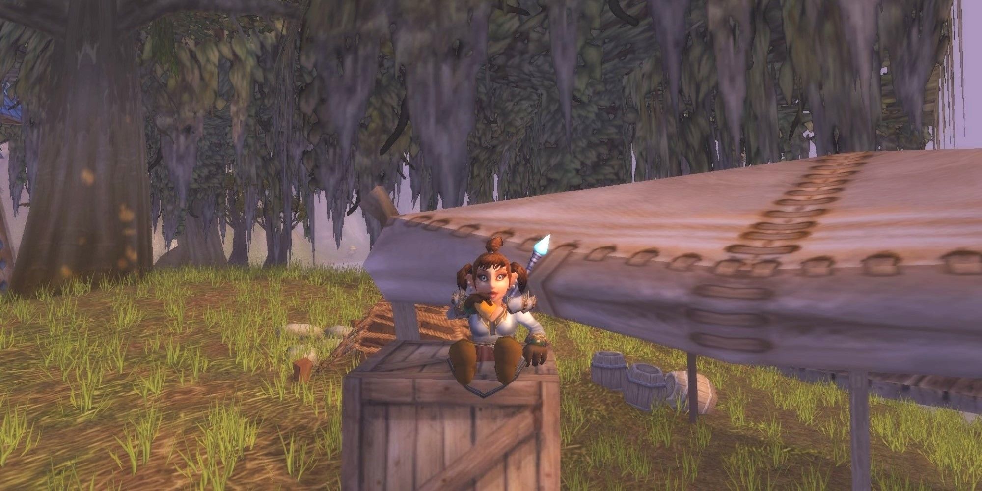 A gnome mage sitting on a crate in Menethil Harbor snacking on some conjured bread