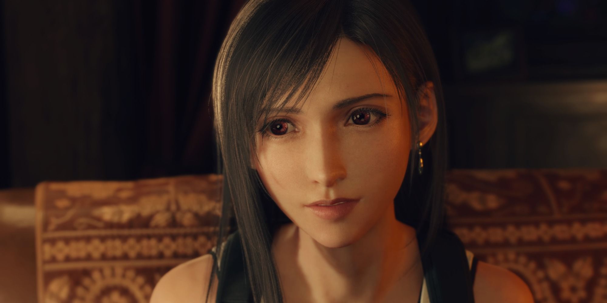 Closeup of Tifa sitting on a couch in FF7 Rebirth