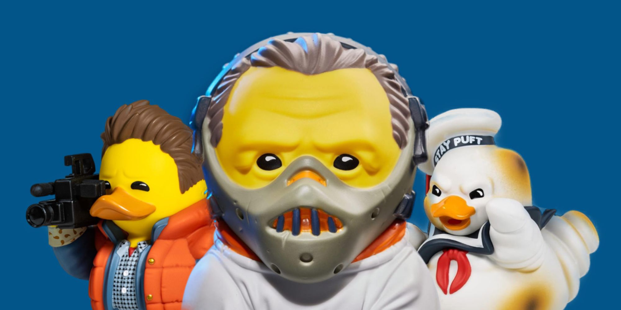 Tubbz Movie-Themed Duck Figure Featured Image Marty McFly, Hannibal, and Marshmallow Man Ducks Stood Together