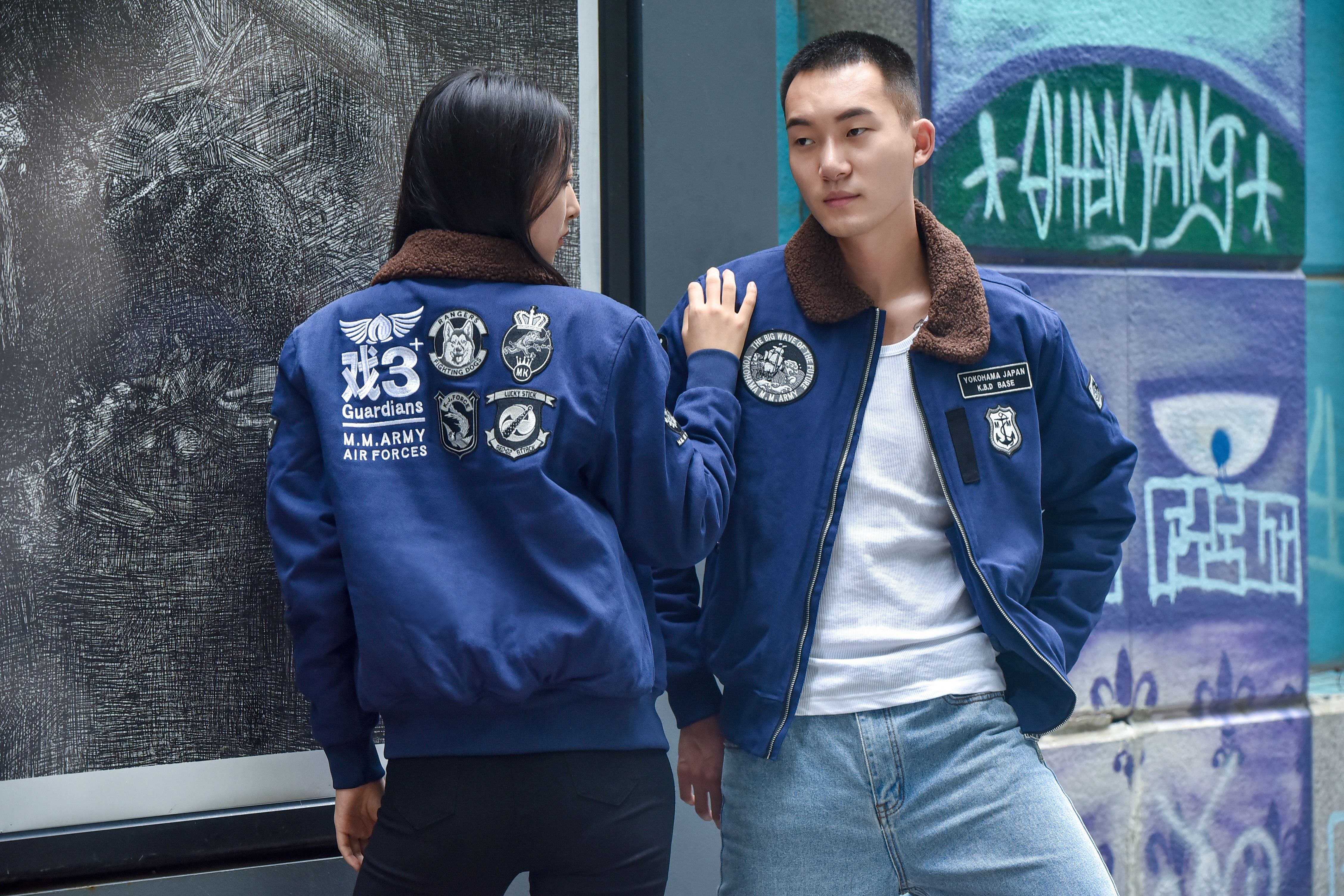 Two models wearing Insert Coin's Adachi jacket.