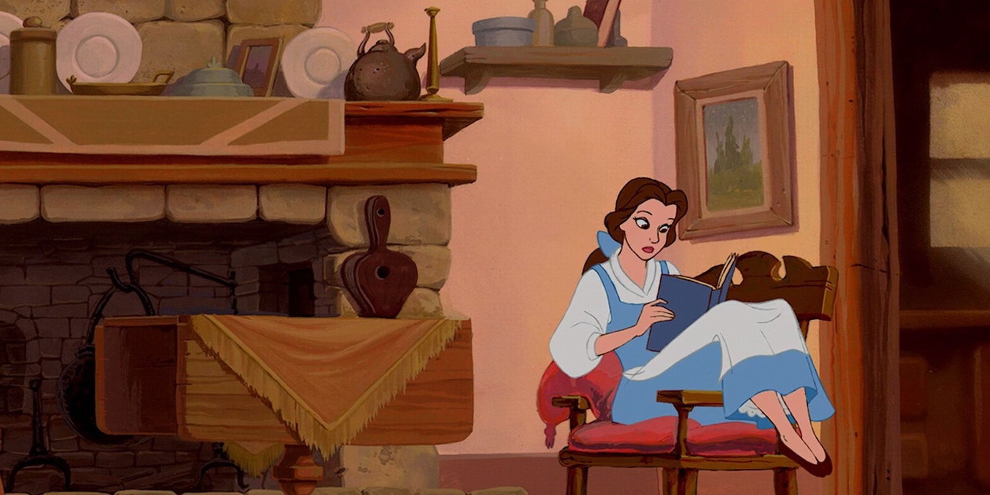 Belle sitting on her chair reading a book