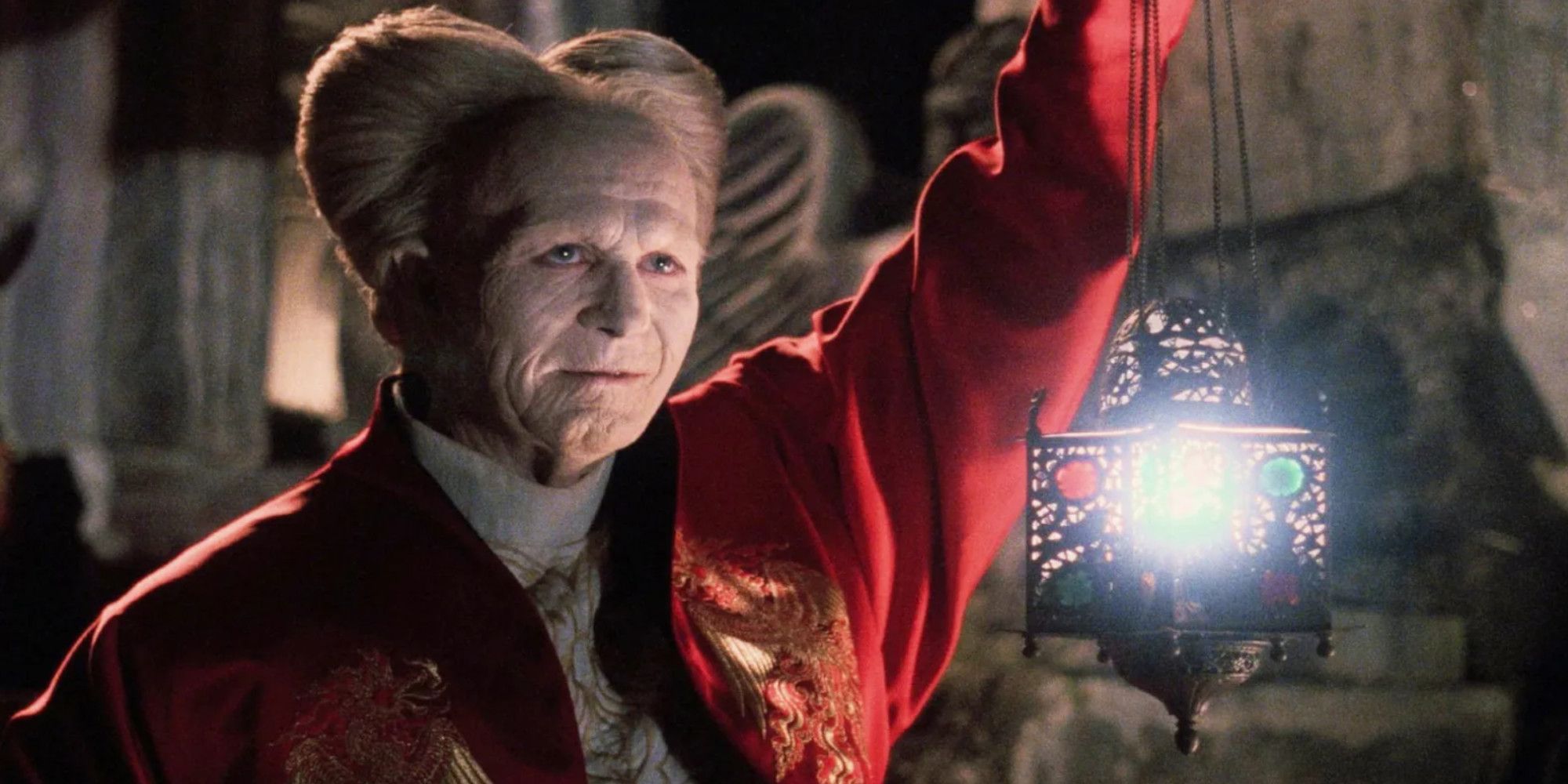Gary Oldman Dracula Holds up lantern while looking ancient in Bram Stoker&rsquo;s Dracula.