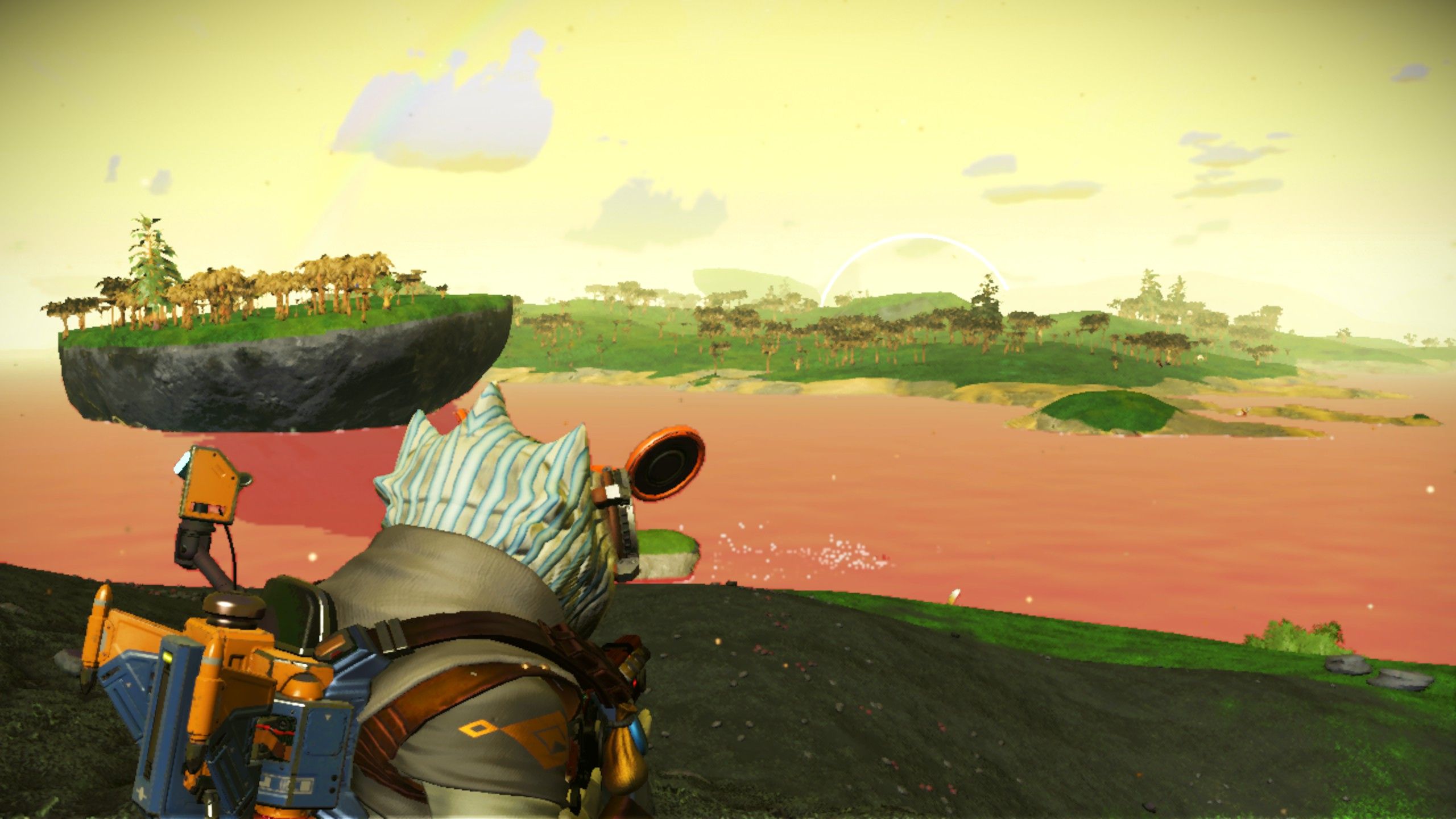 No Man's Sky Marsh Tropical Planet with a gek looking into the red water.