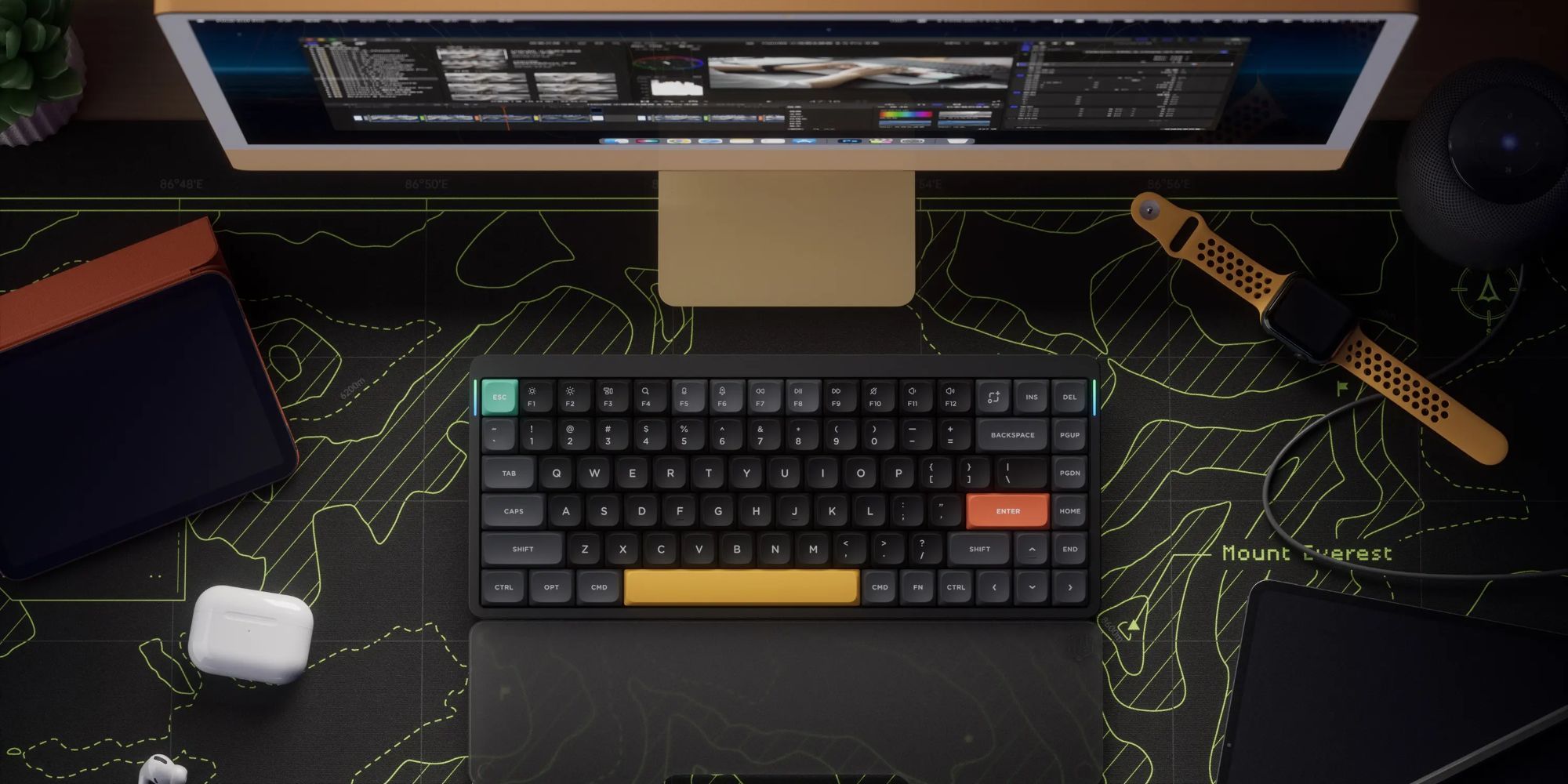 Nuphy Air75 v2 Promo Shot keyboard on a desktop with the screen in front of it