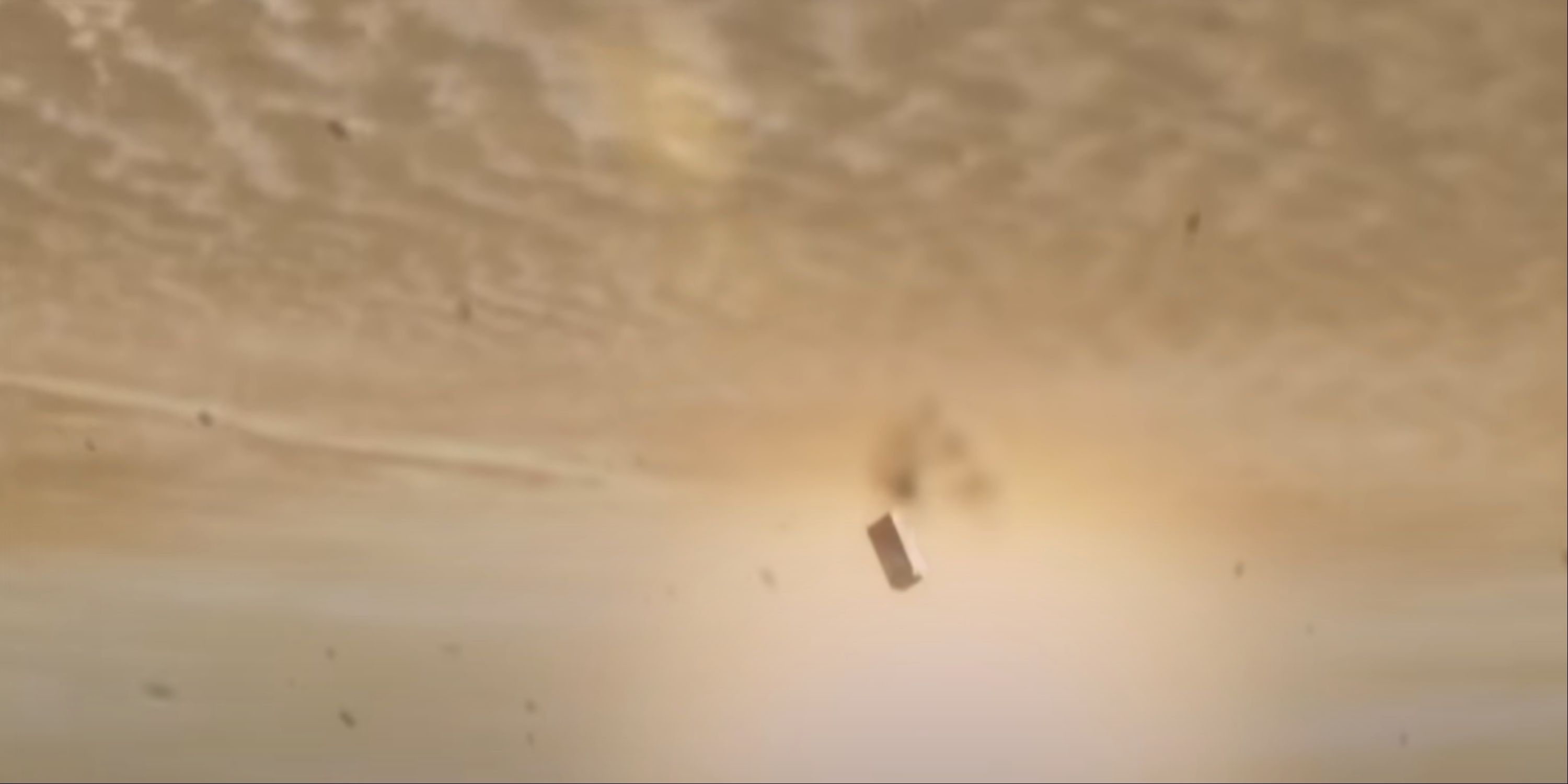 The fridge with Indiana Jones inside flying in the air after the nuclear bomb goes off