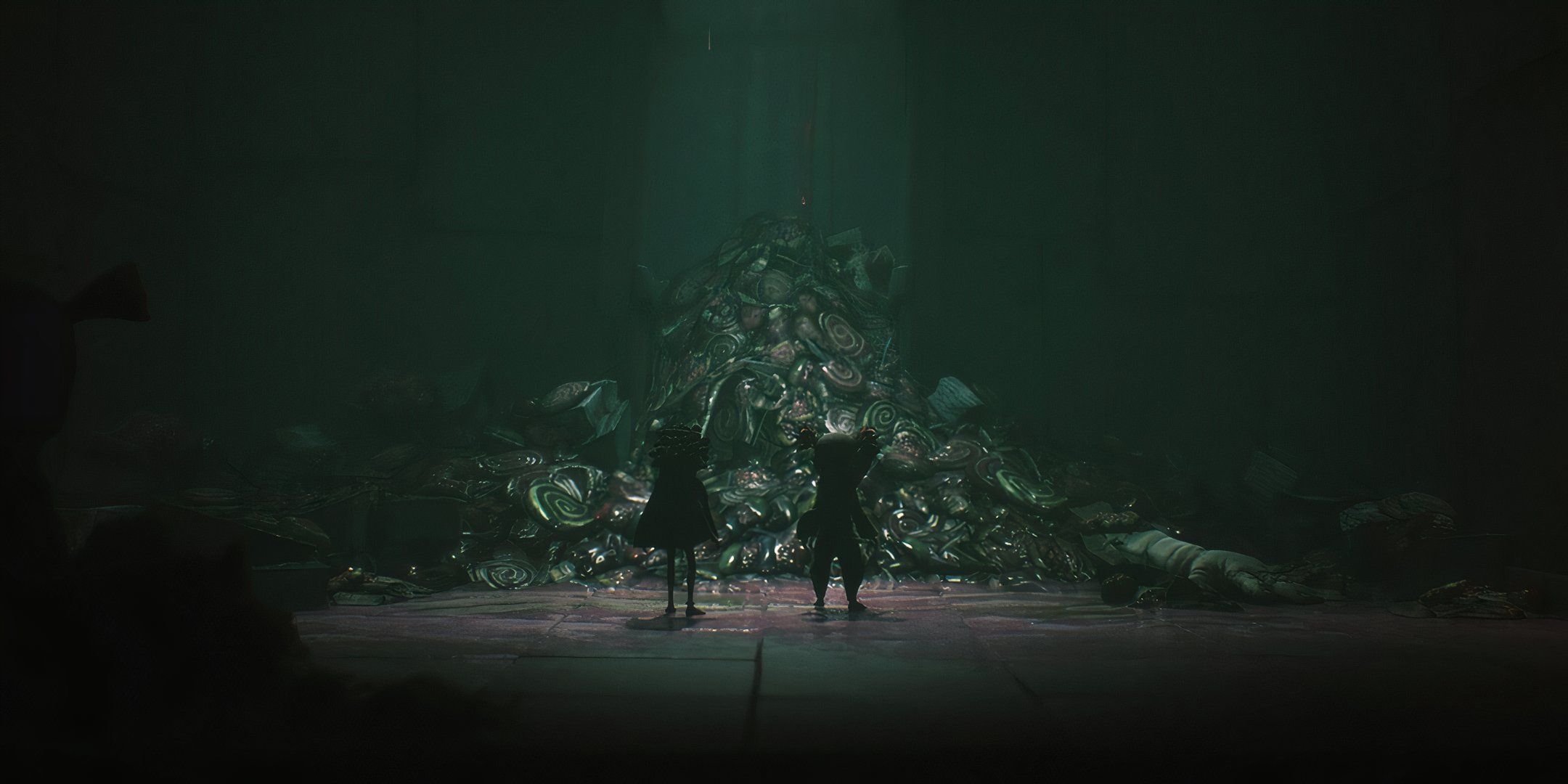 Two characters looking at some rubble in Little Nightmares 3