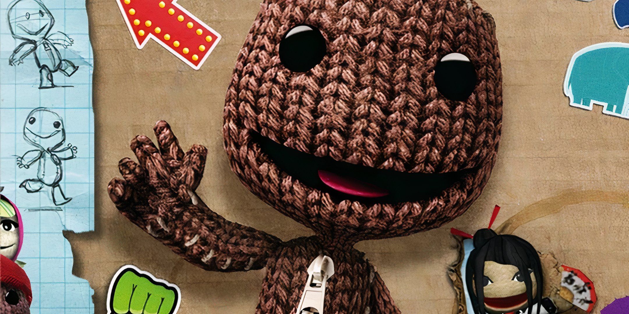 Sackboy waving in front of some cardboard.