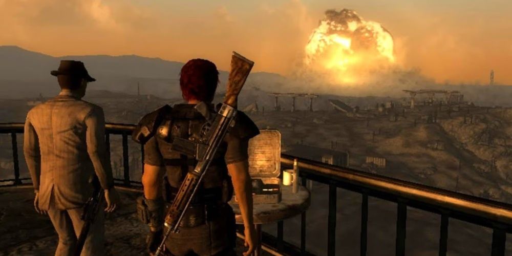 Two men look towards the a nuclear bomb's explosion in Fallout 3's Megaton nuke. 