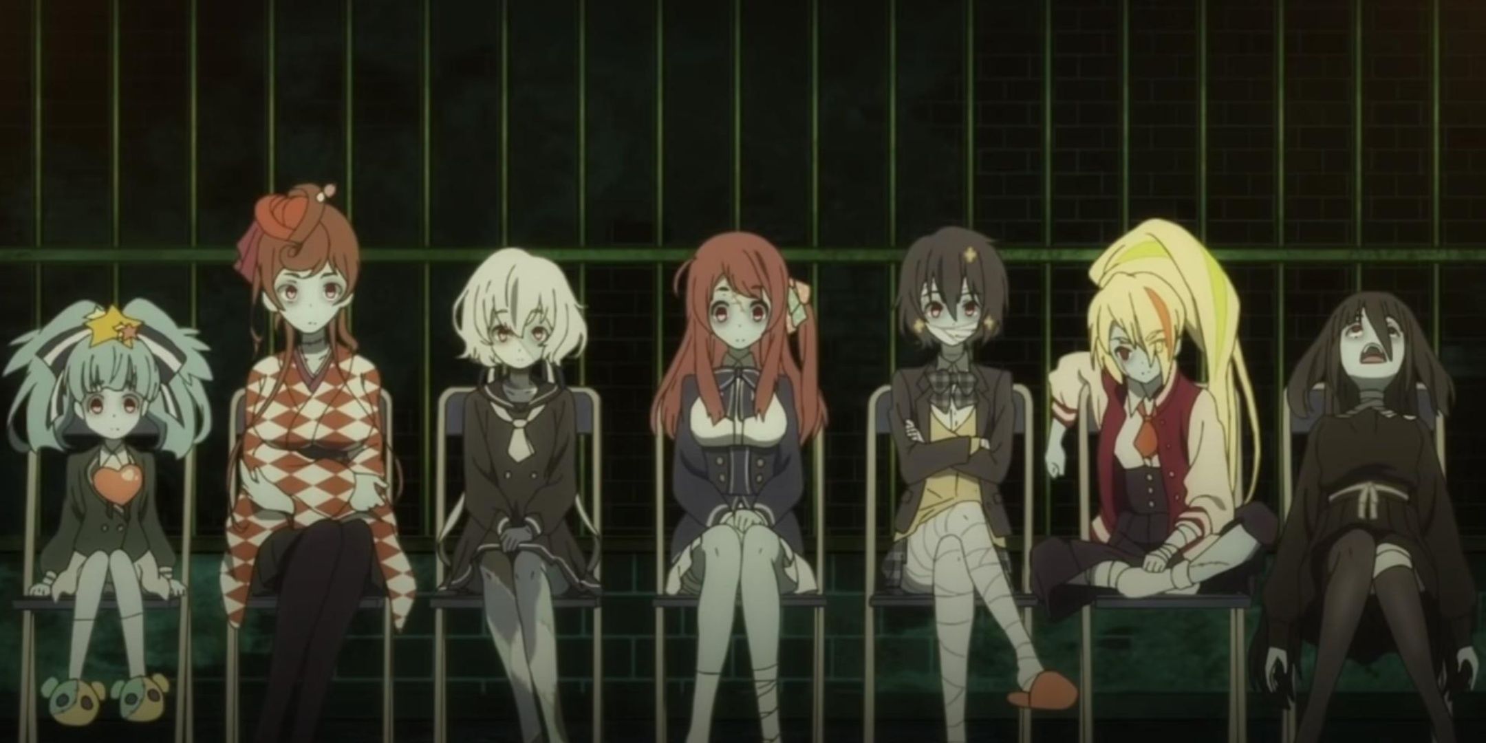 Zombieland Saga idols sit side by side.