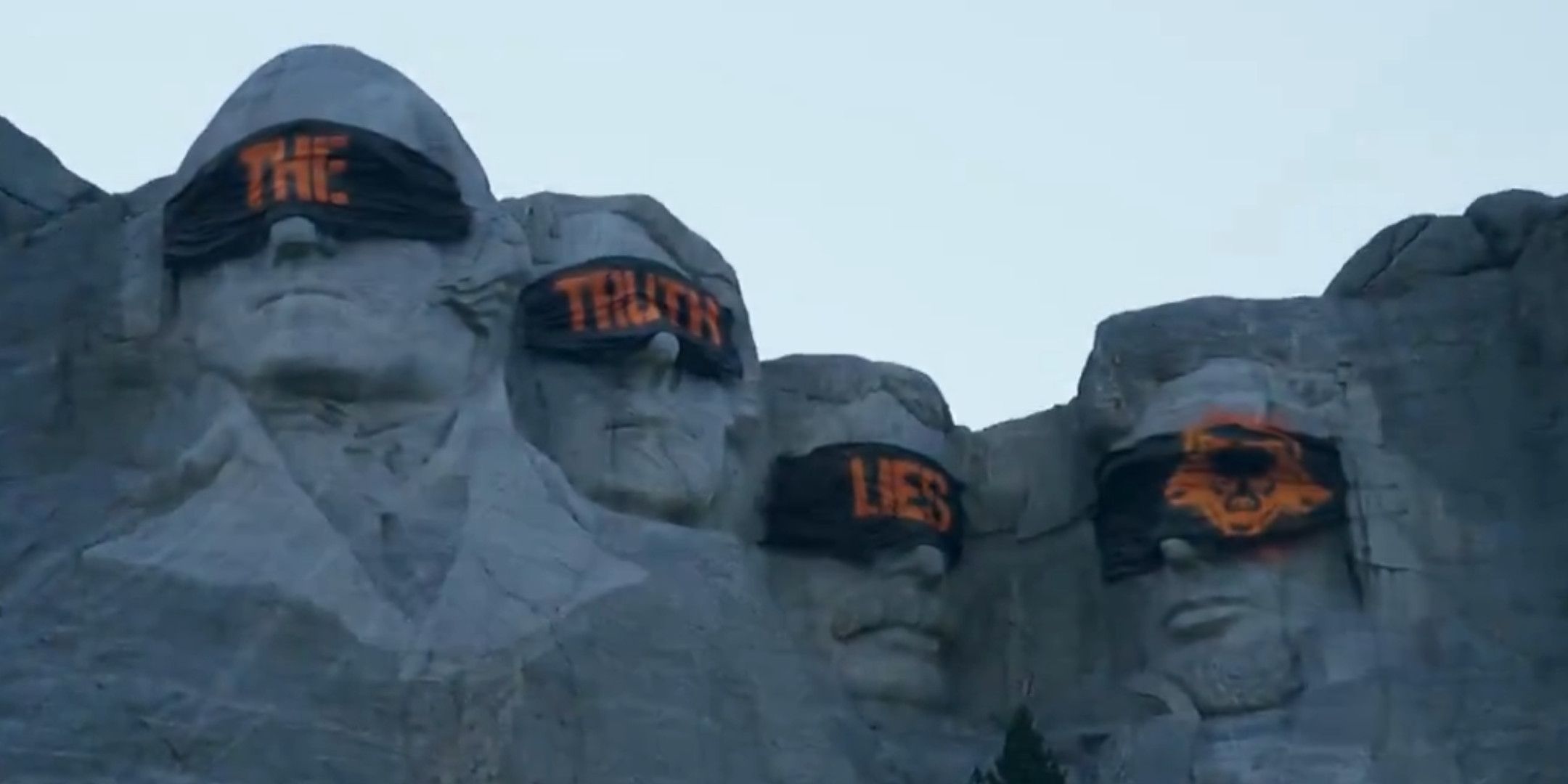 Mount Rushmore but all the head have been covered in blindfolds with the words The Truth Lies written on each one-1