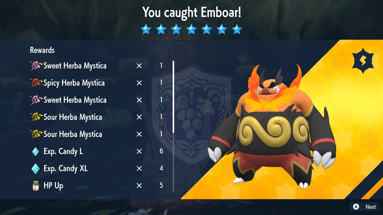 A screenshot from Pokemon Scarlet and Violet showing the reward screen for catching Emboar
