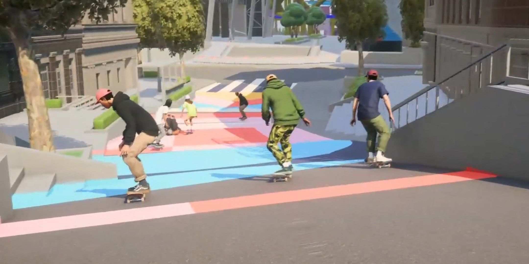 Three skateboarders going down a ramp