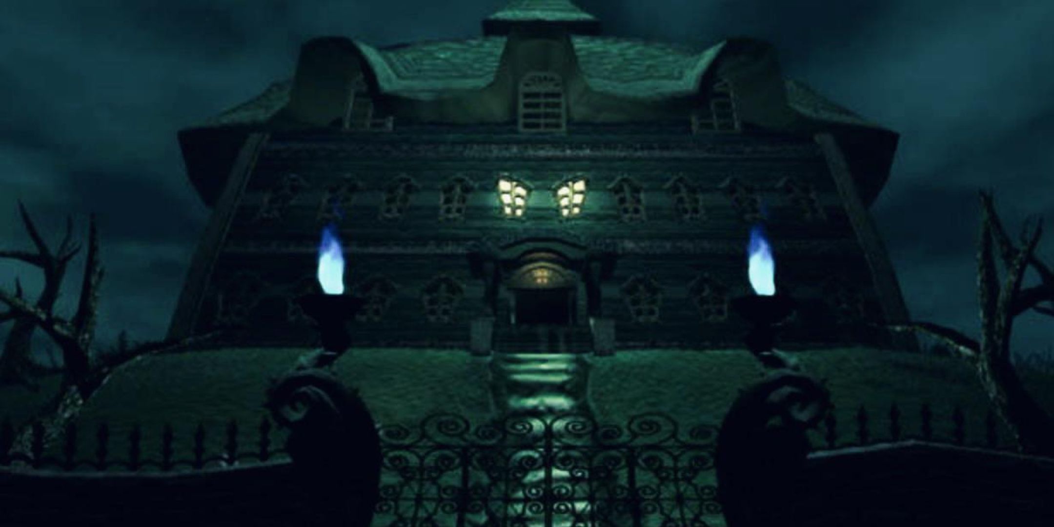 The titular mansion from Luigi's Mansion, lit by ghostly candles and standing beneath an overcast sky.